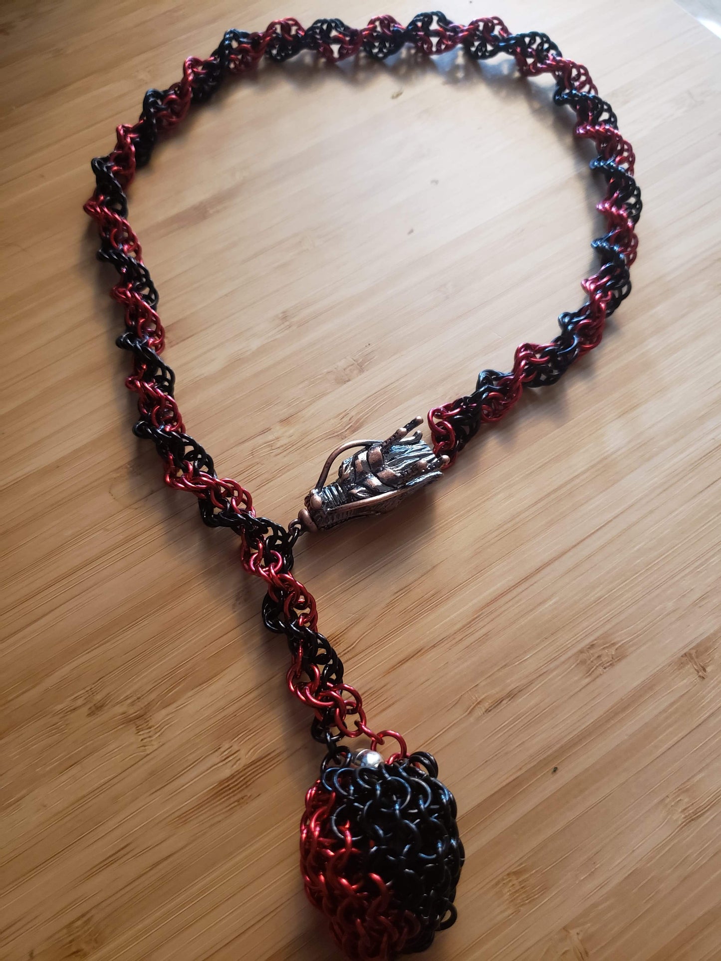 D20 captured necklace with dragon head clasp